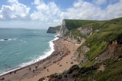 Beach-near-Durdle-Door-on-a-sunny-day-people-sunbathing-Dorset-England-min