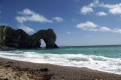 Durdle-Door-Beach-west-of-limestone-arch-Dorset-England-min